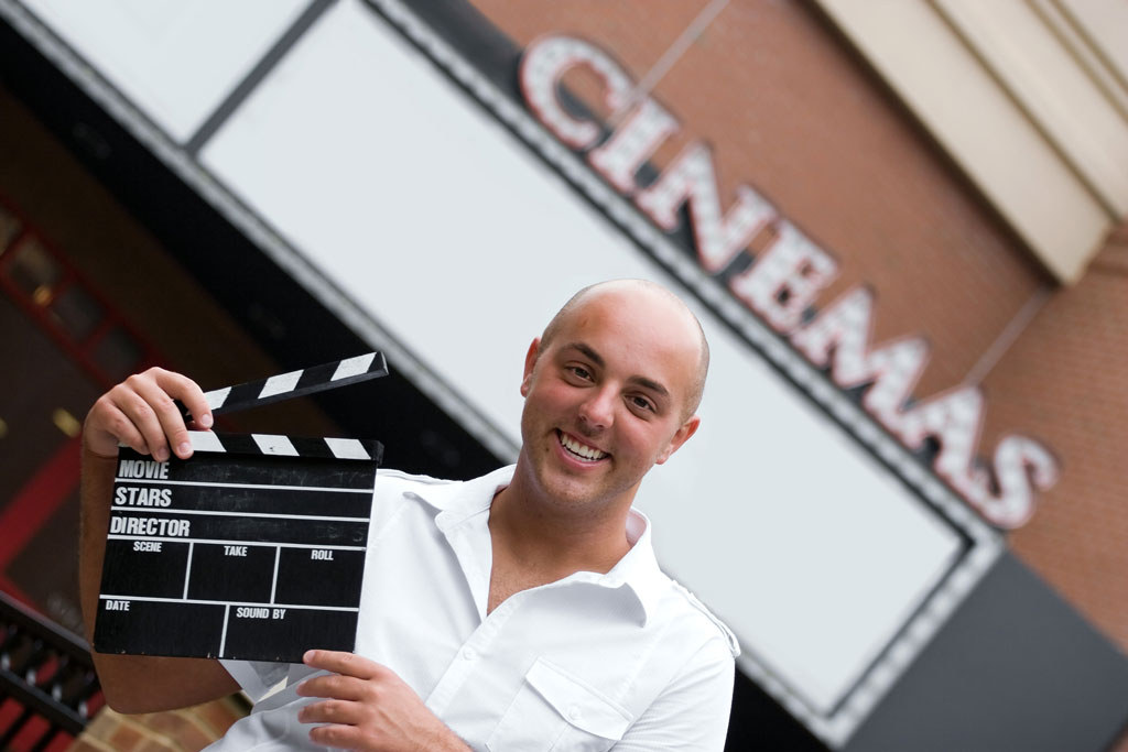 Director holding clapperboard