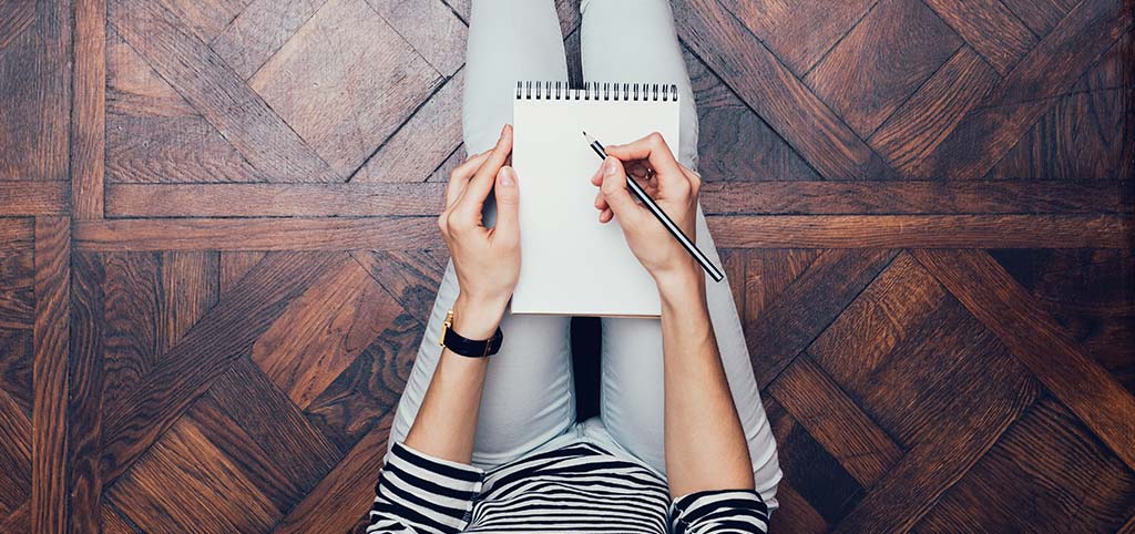 Woman writing in a notebook