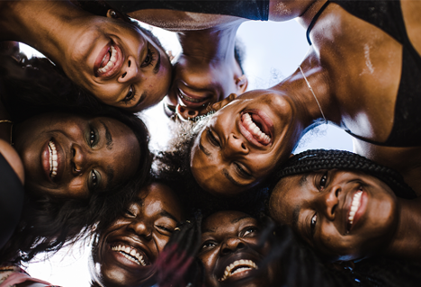 Black women in a group huddle, TONL stock image library