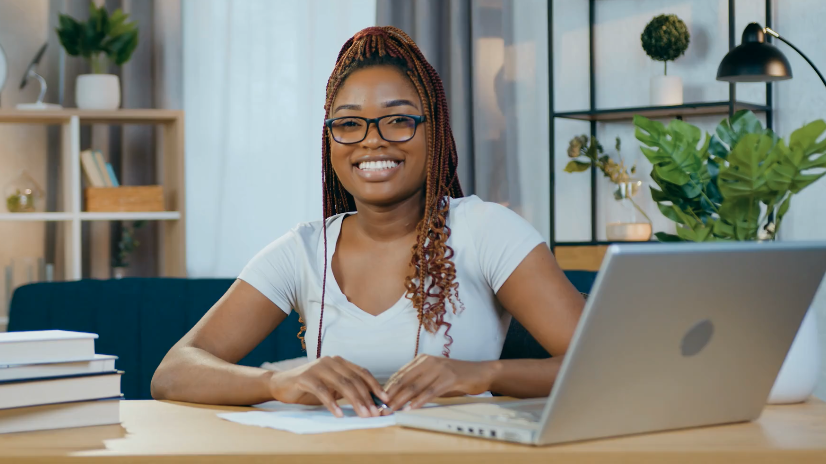 young female black student working at computer