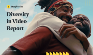 Diversity In Video Report cover art: Two men smiling and hugging under a blue sky
