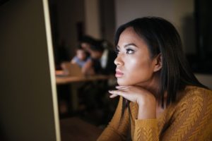 Young woman using video editing tools for beginners on a computer